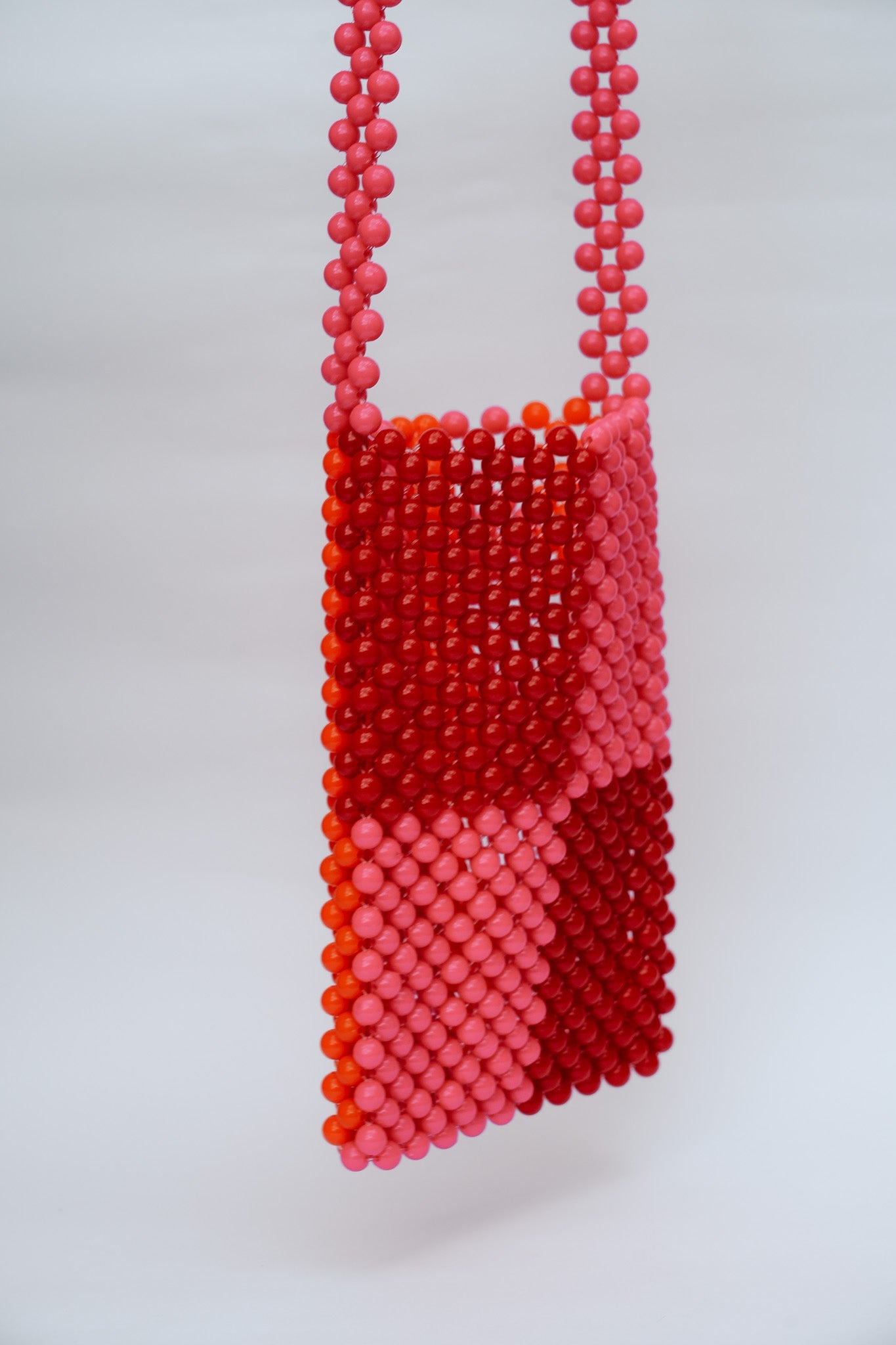 BEADED PHONE BAG - RED/PINK by HIBISCUS THE LABEL - Shop at Black Salt Co